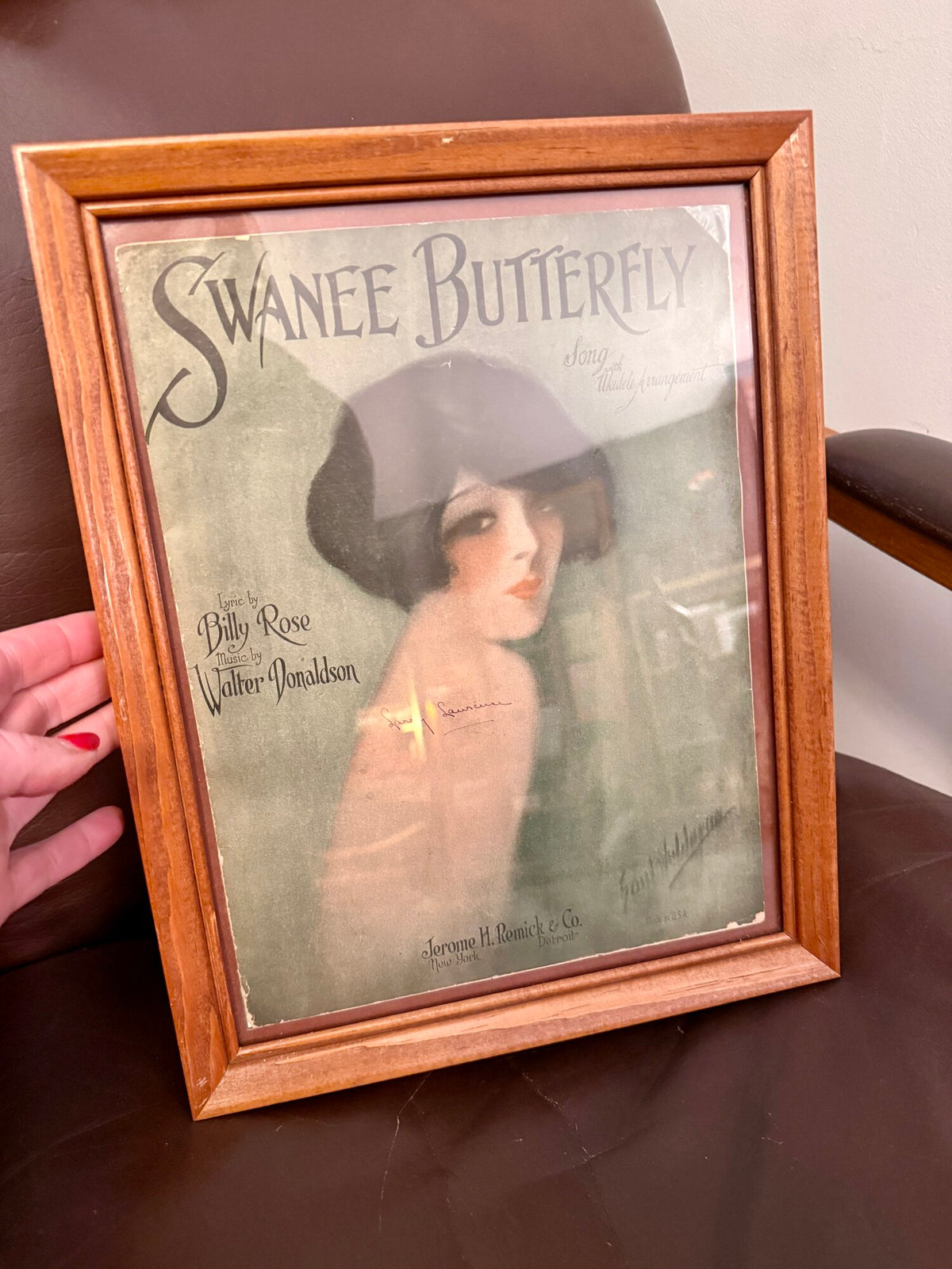 Swanee Butterfly framed sheet music, held
