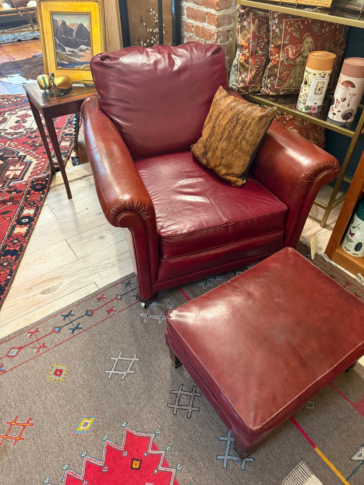 Oxblood leather wingback chair and ottoman