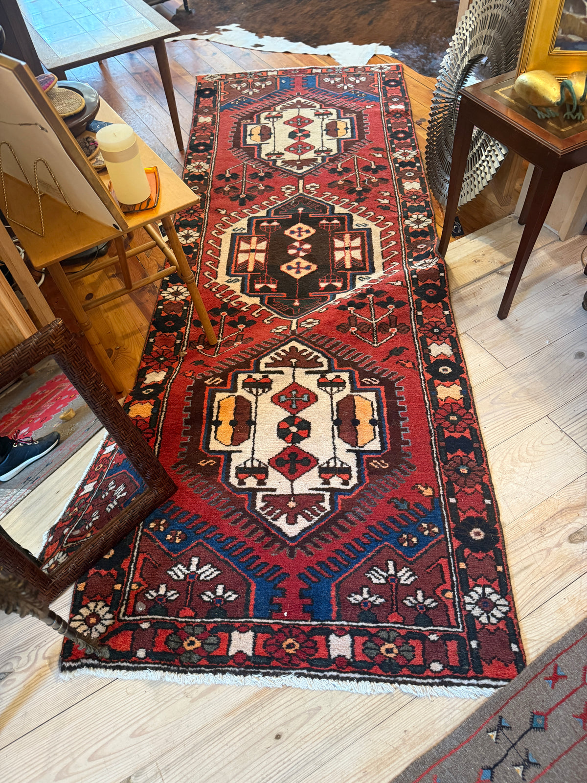 Persian Hamadan hand-knotted rug with red field and geometric medallions