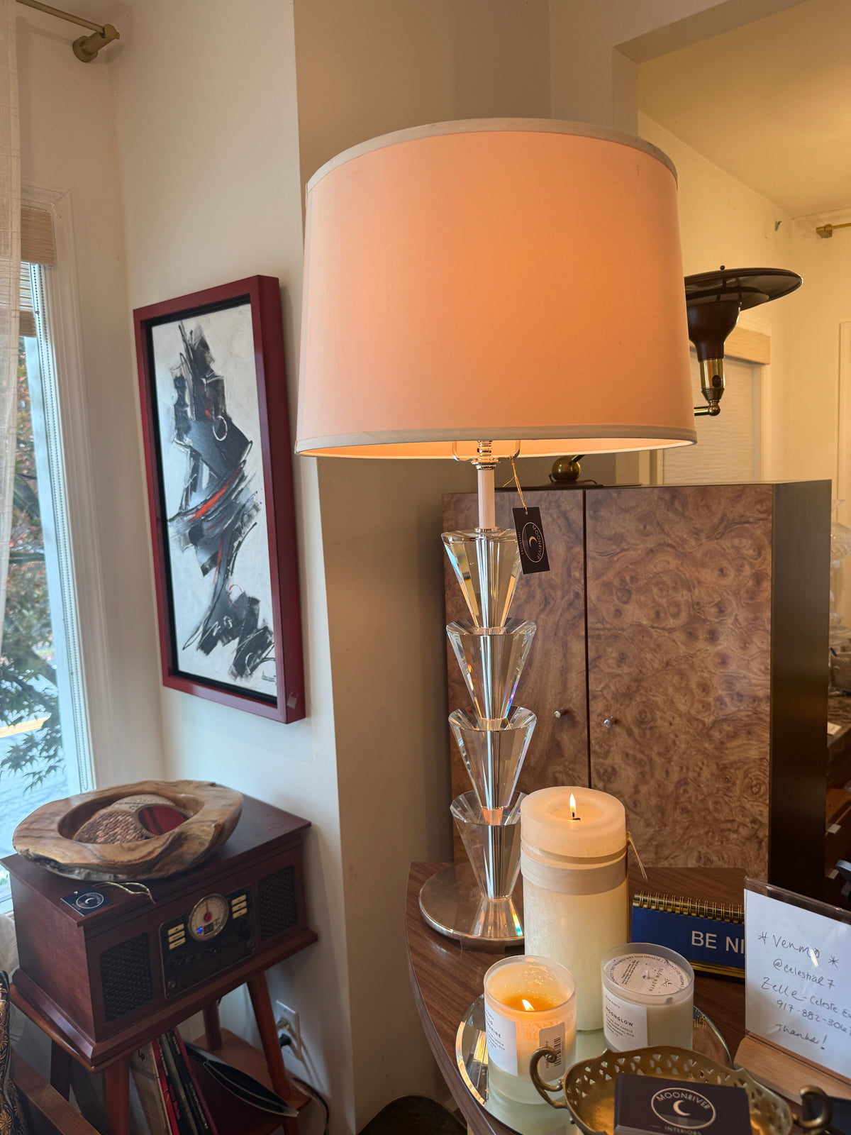 Stacked lucite and chrome table lamp in room setting