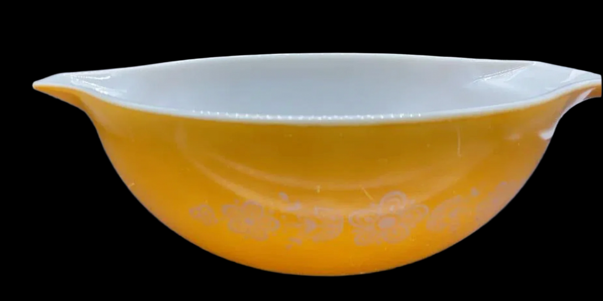 Vintage Pyrex Orange Bowl w/white flowers