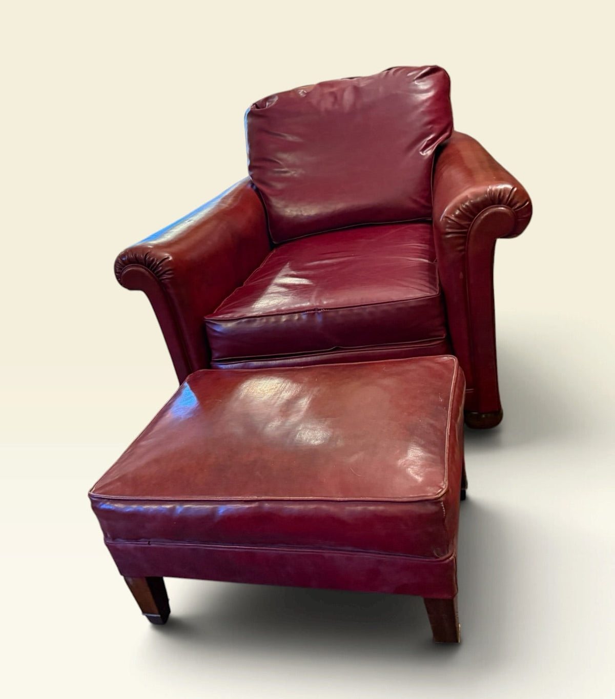 Oxblood vinyl club chair and ottoman